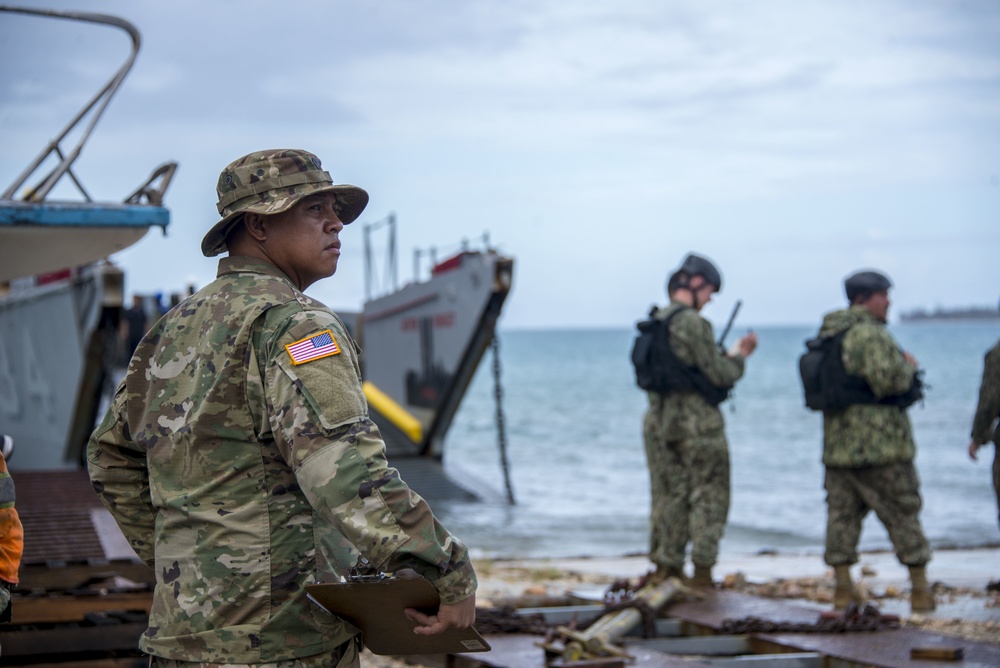 Military Transports Heavy Equipment Vehicles to Saipan in Response to Super Typhoon Yutu