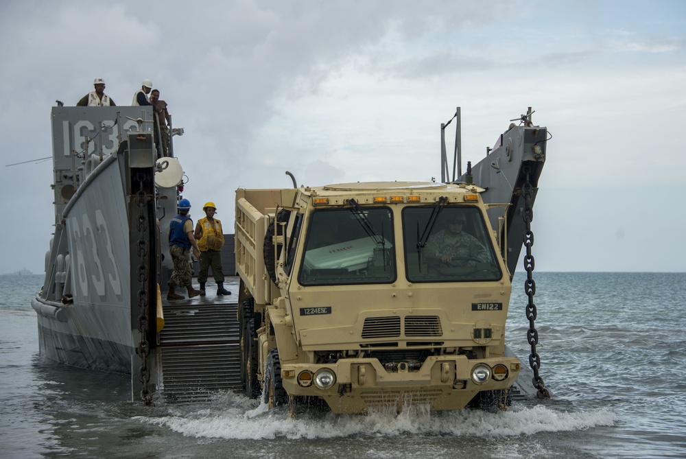 Military Transports Heavy Equipment Vehicles to Saipan in Response to Super Typhoon Yutu