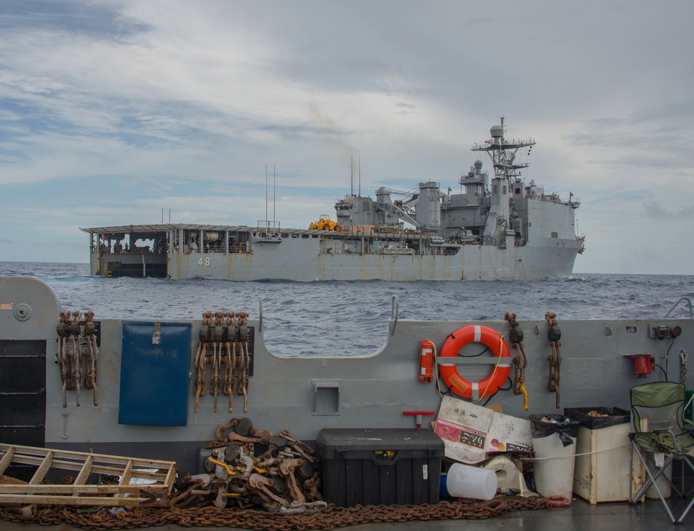 Military Transports Heavy Equipment Vehicles from the USS Ashland to Saipan in Response to Super Typhoon Yutu