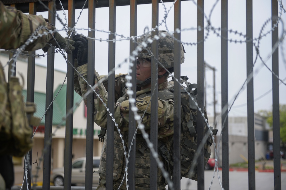 Soldiers Lay Barbed Wire At Gateway International Bridge