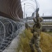 Soldiers Lay Barbed Wire At Gateway International Bridge