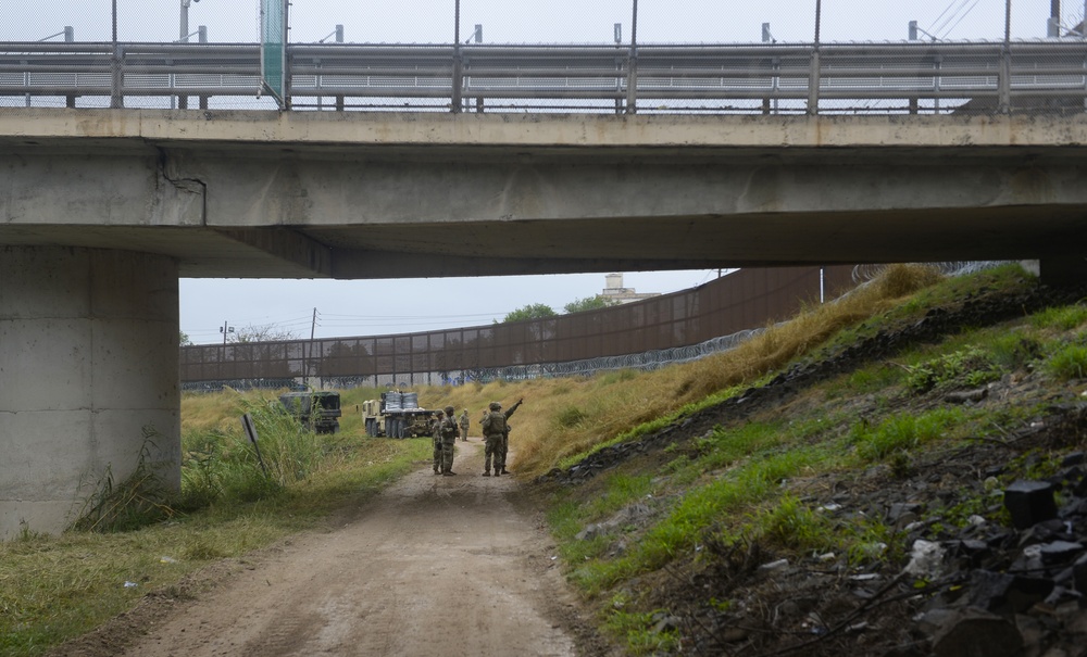Soldiers Lay Barbed Wire At Gateway International Bridge