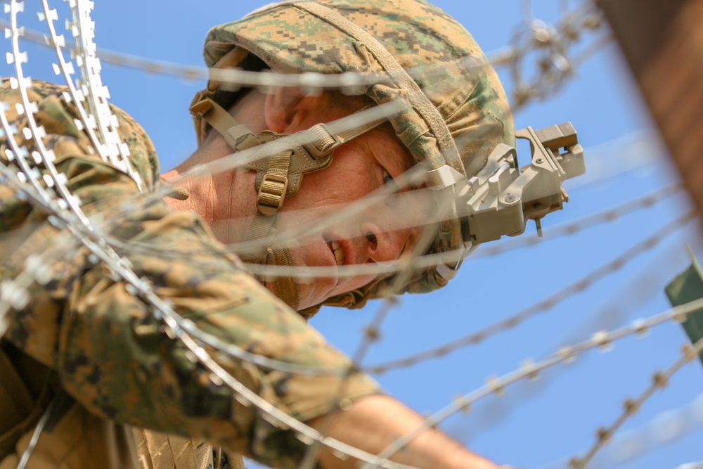 Col. Kyle Ellison Lays Concertina Wire on Border Fencing