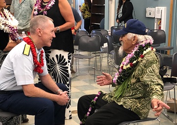 Rear Adm. Kevin Lunday talks with Mitchell Lani
