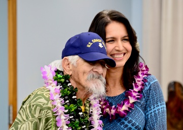 Rep. Tulsi Gabbard presents Mitchell Lani with Congressional citation