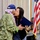 Leah Belmonte presents Mitchell Lani a certificate on behalf of Gov. David Ige