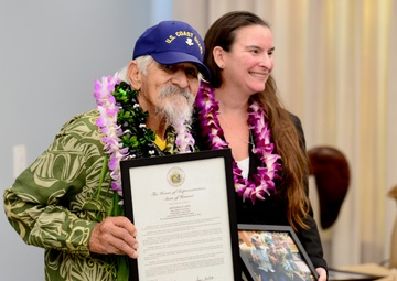 Rebecca Crall presents a certificate on behalf of Rep. Lynn DeCoite