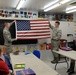 Airmen teach students proper flag procedures