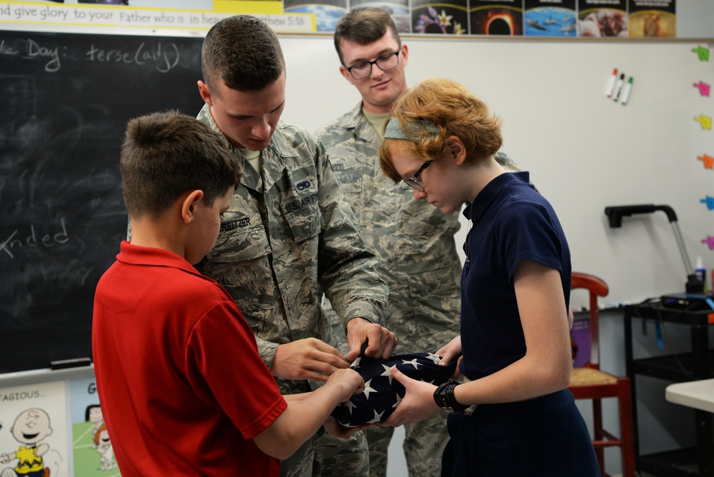 Airmen teach students proper flag procedures