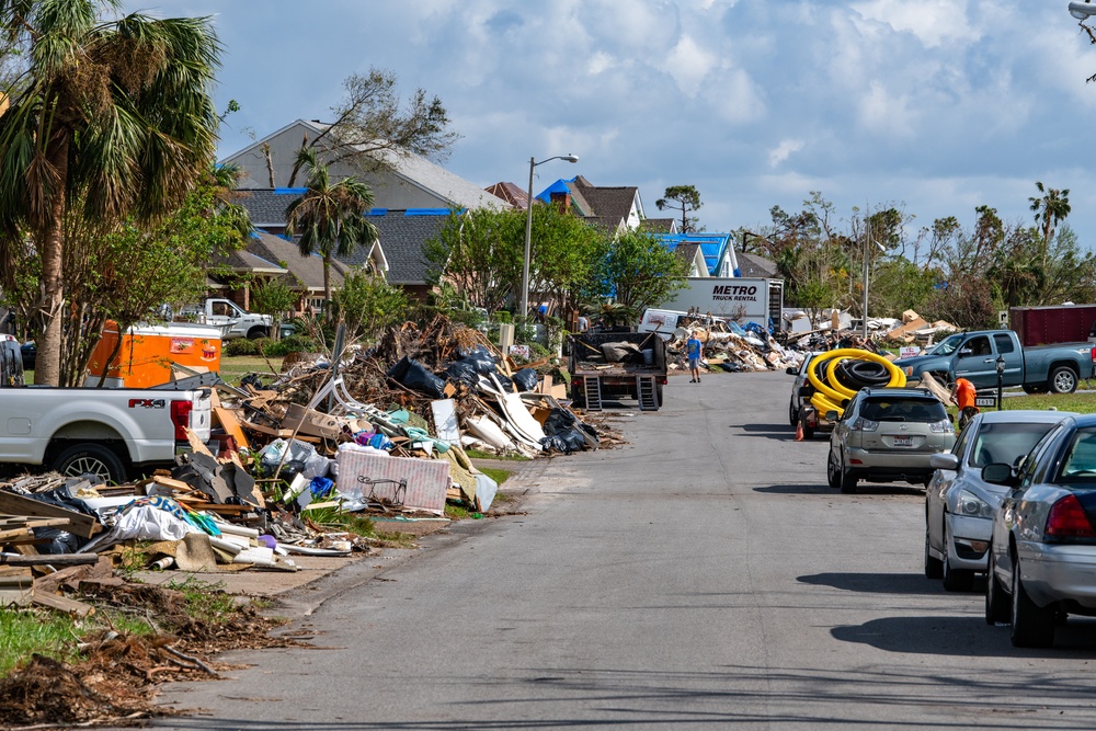 Residents Move Debris To Curb