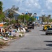 Residents Move Debris To Curb