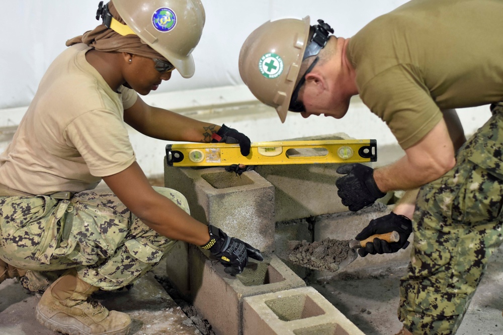 NMCB-3 Det. Diego Garcia constructs concrete bus stop