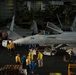 Sailors prepare to taxi aircraft in the hangar bay aboard the Nimitz-class aircraft carrier USS John C. Stennis (CVN 74).