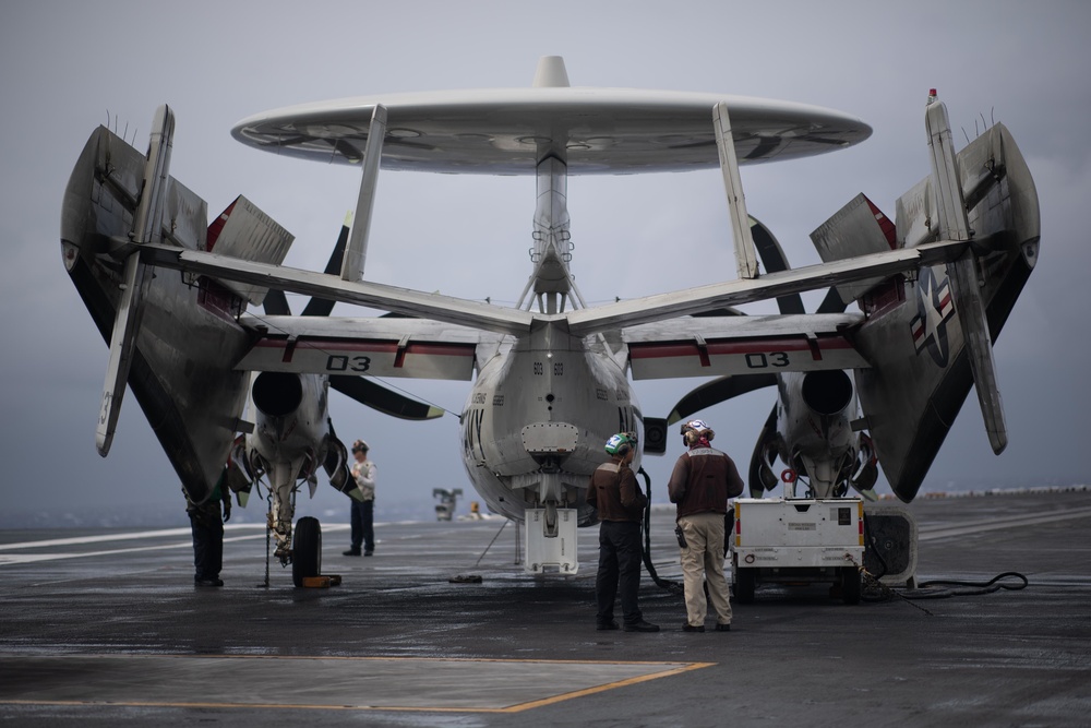 Sailors conduct a preflight check aboard Stennis