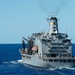 The fleet replenishment oiler USNS Guadalupe (T-AO 200) maintains course for the Nimitz-class aircraft carrier USS John C. Stennis (CVN 74) to come alongside for a refueling-at-sea.