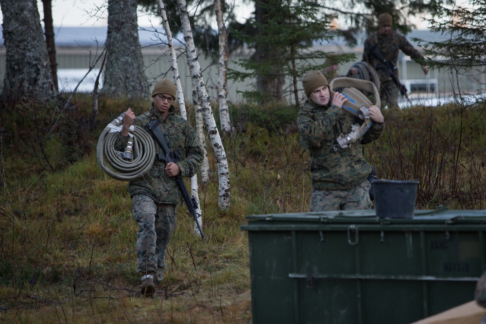 8th ESB Marines Wash Equipment Prior to Storage