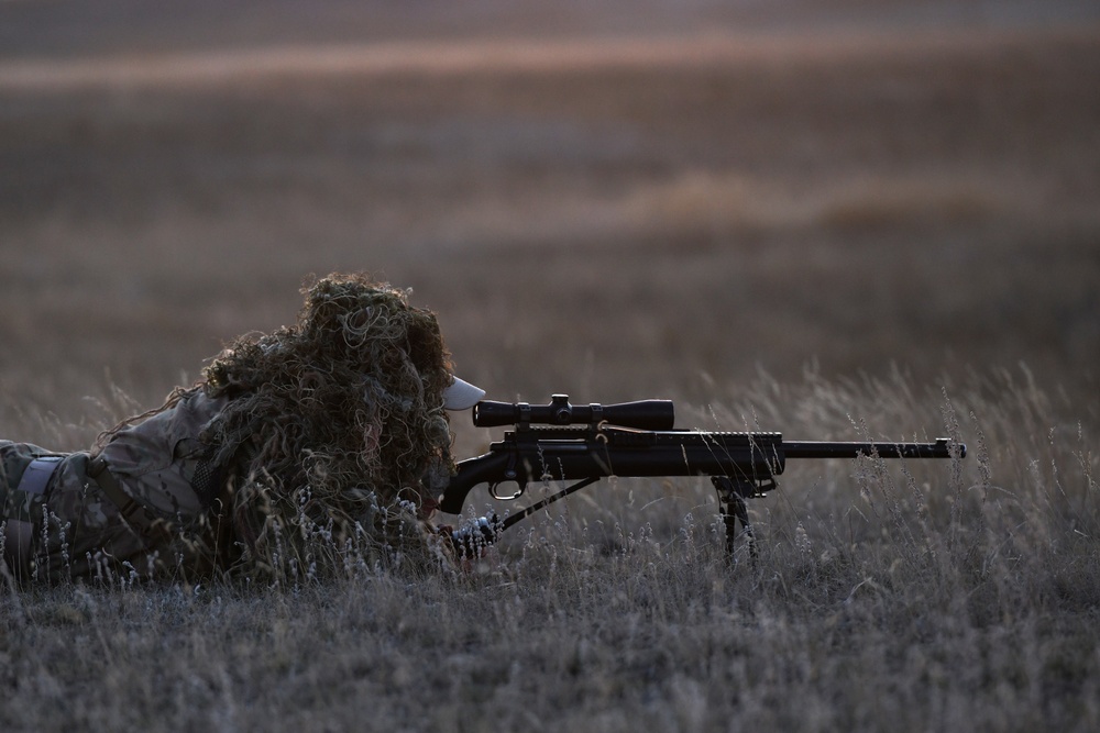 A nuclear advanced designated marksman from the 341st Security Support Squadron Tactical Response Force member assists in a launch facility recapture exercise during Global Thunder 19, Oct. 30, 2018, at Malmstrom Air Force Base, Mont.