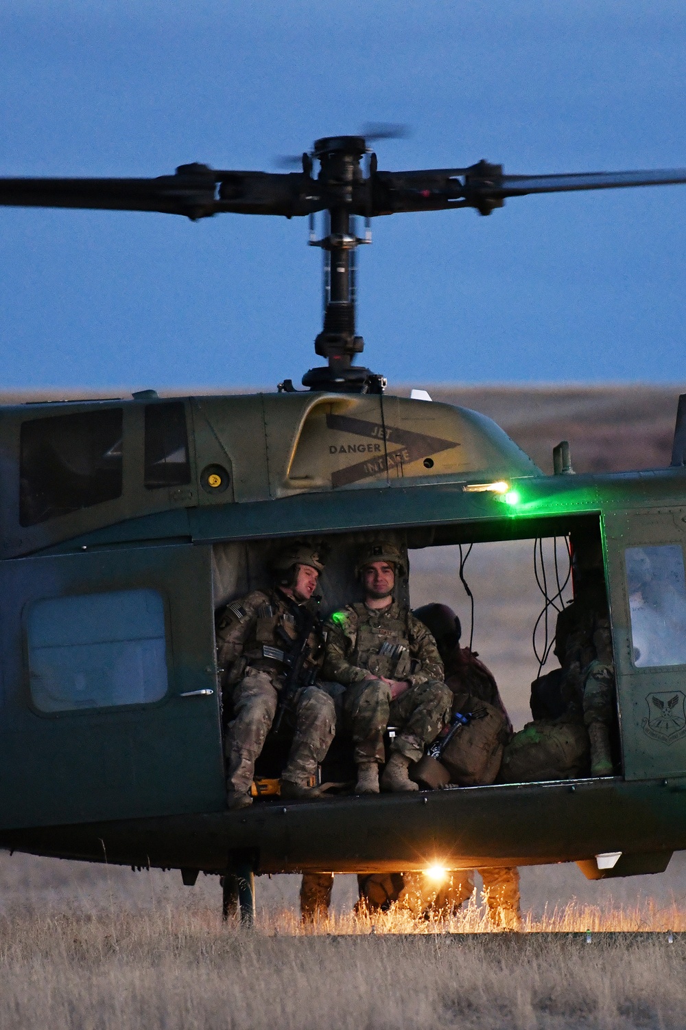 Members of the 341st Security Forces Group prepare to load a helicopter assigned to the 40th Helicopter Squadron during a launch facility recapture exercise during Global Thunder 19, Oct. 30, 2018, at Malmstrom Air Force Base, Mont.