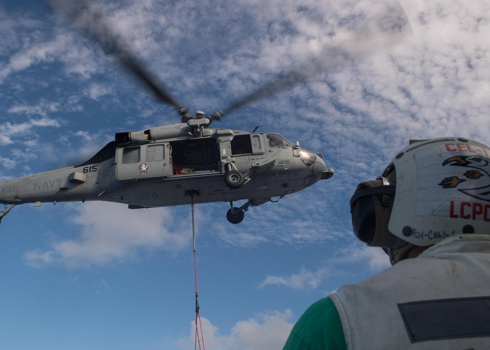 MH-60S Sea Hawk, with Helicopter Sea Combat Squadron (HSC) 14, conducts a vertical replenishment-at-sea.