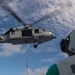 MH-60S Sea Hawk, with Helicopter Sea Combat Squadron (HSC) 14, conducts a vertical replenishment-at-sea.