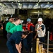 Chief Boatswain's Mate Alfonso Guerrero instructs line handlers aboard the Nimitz-class aircraft carrier USS John C. Stennis (CVN 74) during a replenishment-at-sea evolution.