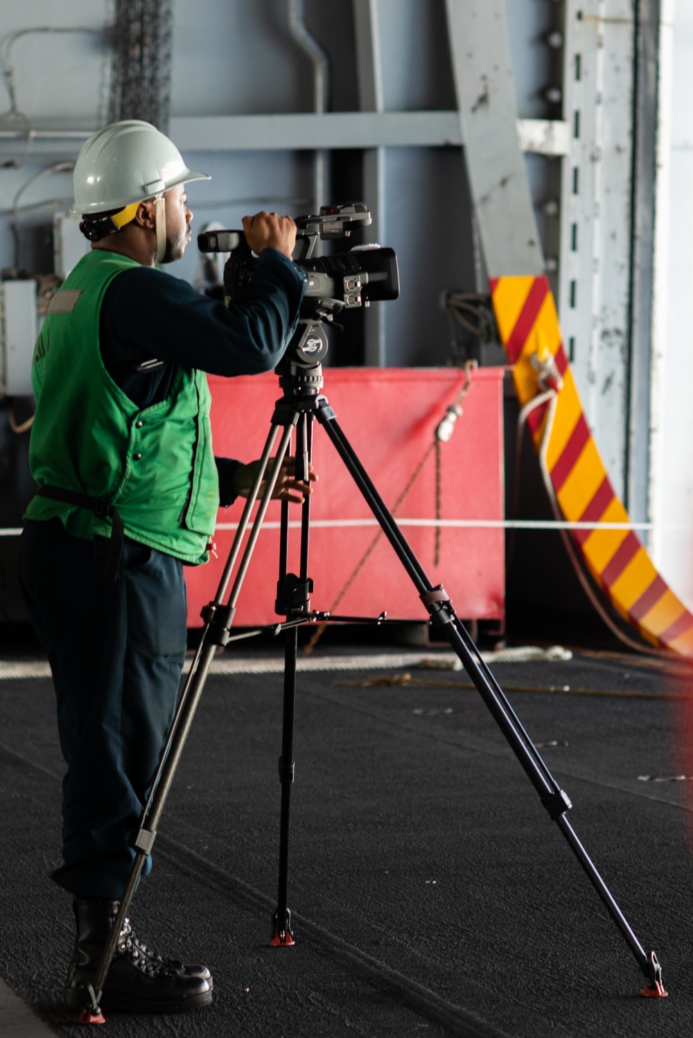 Mass Communication Specialist 2nd Class Charles Gaddis records a replenishment-at-sea evolution aboard the Nimitz-class aircraft carrier USS John C. Stennis (CVN 74).