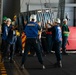 Boatswain's Mate 3rd Class Tanesha Brown directs Sailors during a replenishment-at-sea evolution aboard the Nimitz-class aircraft carrier USS John C. Stennis (CVN 74).