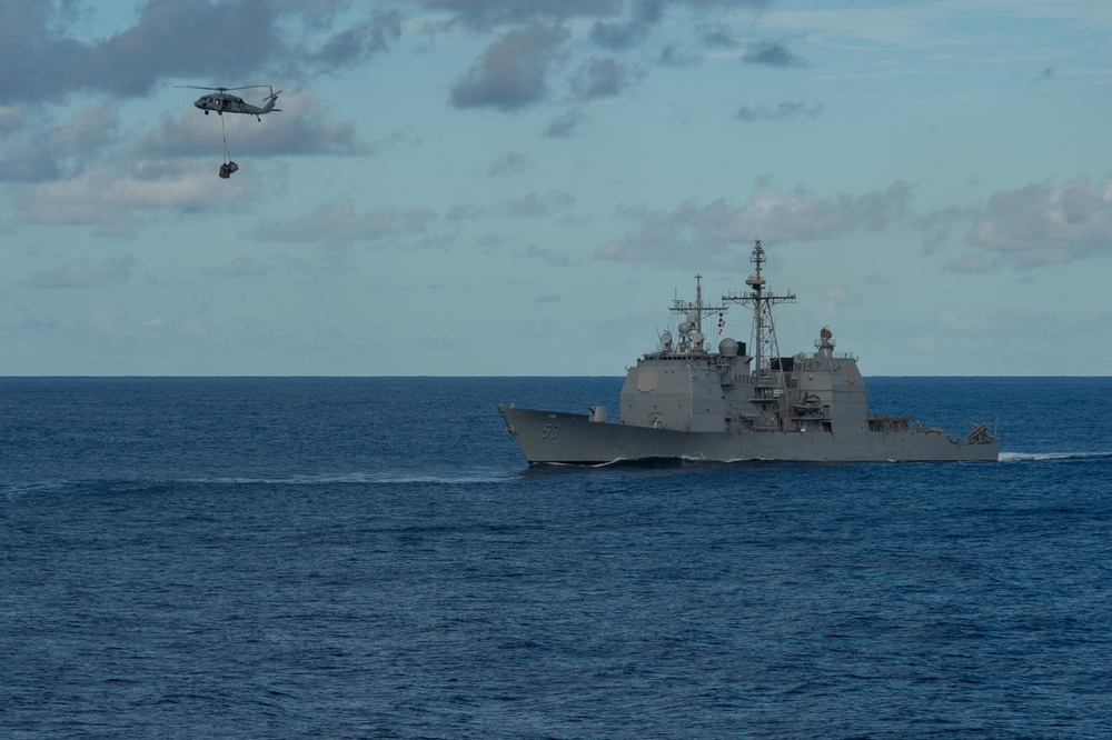 USS Mobile Bay (CG 53) transits the Pacific Ocean during a replenishment-at-sea evolution.