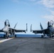 Aviation Electronics Technician Airman Michael McDonald, left and Airman Bailey Allen clean the canopies of F/A-18E Super Hornets on the flight deck aboard the Nimitz-class aircraft carrier USS John C. Stennis (CVN 74).