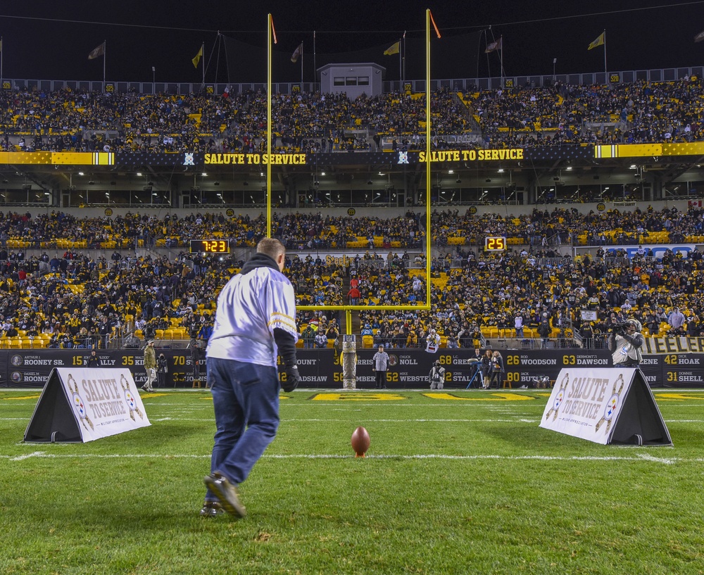 Air Force Reservist Lines Up a Field Goal During Contest