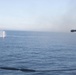 USS Spruance (DDG 111) engages a simulated surface contact with a Mark 38 25 mm machine gun system during a live fire evolution with the Arleigh Burke-class guided-missile destroyer USS Stockdale (DDG 106).