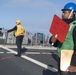 Culinary Specialist 2nd Class Delon Hurd, from Jackson, Michigan, communicates with the Military Sealift Command (MSC) fleet replenishment oiler USNS Guadalupe (T-AO 200) during a replenishment-at-sea.