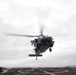 An MH-60S Sea Hawk, with Helicopter Sea Combat Squadron (HSC) 14, approaches the flight deck of the Arleigh Burke-class guided-missile destroyer USS Spruance (DDG 111) to land.