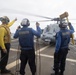 Sailors present chocks and chains to the pilot of an MH-60S Sea Hawk, with the Helicopter Sea Combat Squadron (HSC) 14, during flight operations aboard USS Spruance (DDG 111).