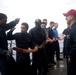 Hull Maintenance Technician 1st Class Brian Canaday, right, watches Operations Specialist Seaman Arturo Ruachomadrigal, second from left, during damage control training aboard USS Spruance (DDG 111).