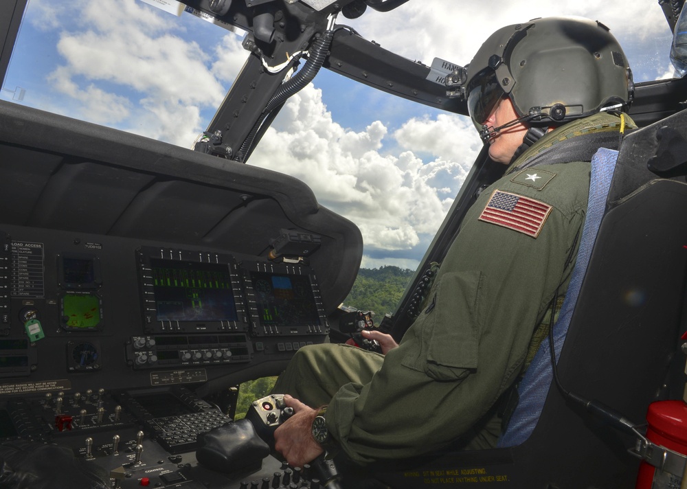 Rear Adm. Joey Tynch Pilots Brunei Armed Forces Black Hawk Helicopter