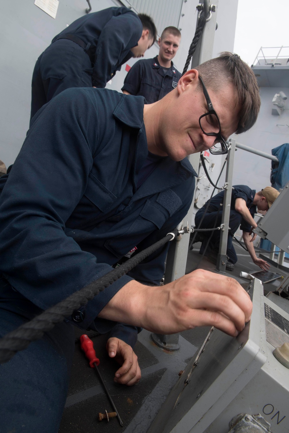 Cryptologic Technician (Technical) 3rd Class Johncole Mcardle performs maintenance on a MK-53 Electronic Decoy System aboard USS Spruance (DDG 111).