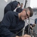 Cryptologic Technician (Technical) 3rd Class Johncole Mcardle performs maintenance on a MK-53 Electronic Decoy System aboard USS Spruance (DDG 111).
