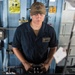 Seaman Easton Rabin steers the ship aboard USS Mobile Bay (CG 53).