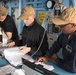Quartermasters review the Voyage Management System aboard USS Mobile Bay (CG 53).