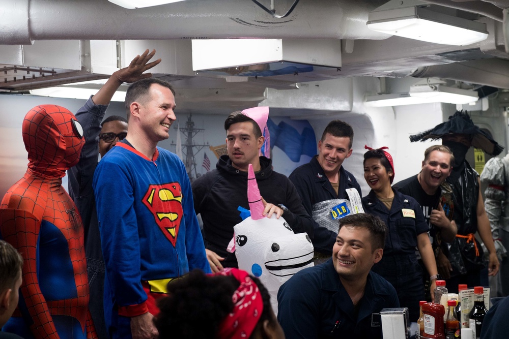 Sailors assigned to USS Stockdale (DDG 106) participate in a Morale, Welfare and Recreation (MWR) Halloween costume contest.