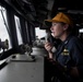 Lt. Kristin Rovito passes a message as the officer of the deck in the pilot house aboard USS Spruance (DDG 111).