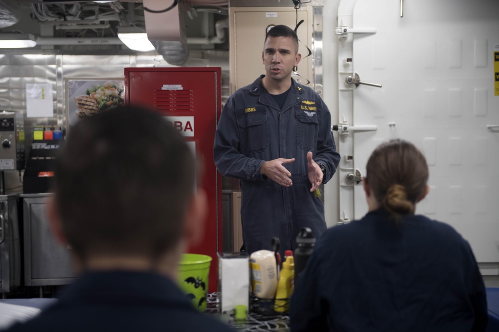 Chief Warrant Officer 3 Byron Gibbs gives training aboard USS Spruance (DDG 111).