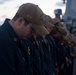 Lt. Mark Brandau bows his head for the invocation during a change of command ceremony aboard USS Stockdale (DDG 106).