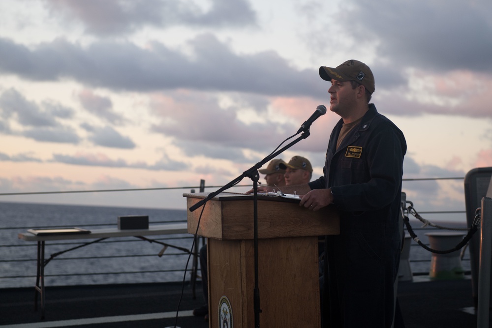 Cmdr. John Halttunen, commanding officer of USS Stockdale (DDG 106), addresses the crew before turning over command to Cmdr. Leonard Leos during a change of command ceremony.