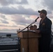 Cmdr. John Halttunen, commanding officer of USS Stockdale (DDG 106), addresses the crew before turning over command to Cmdr. Leonard Leos during a change of command ceremony.