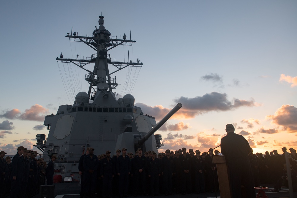 Cmdr. Leonard Leos, commanding officer of USS Stockdale (DDG 106), addresses the crew after assuming command during a change of command ceremony.