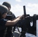 Mate Seaman Apprentice Maricella Holper reloads an M240B machine gun during a crew-served weapons qualification course aboard USS Spruance (DDG 111).