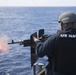 Gunner’s Mate Seaman Apprentice Maricella Holper, right, fires an M240B machine gun during a crew-served weapons qualification course aboard USS Spruance (DDG 111).