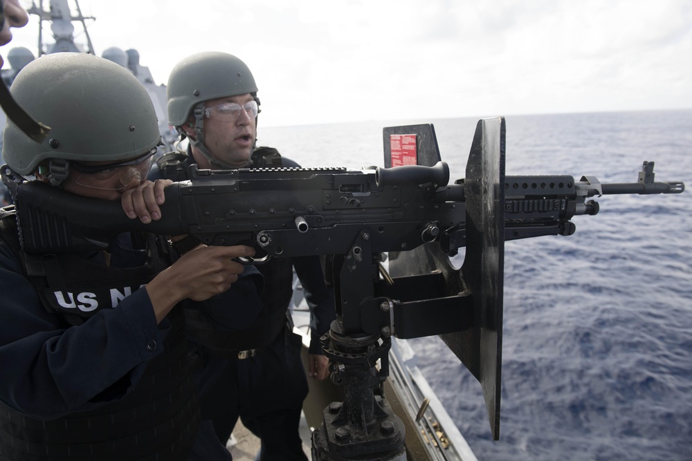 Gunner’s Mate Seaman Clay Jackson fires an M240B machine gun during a crew-served weapons qualification course aboard USS Spruance (DDG 111).